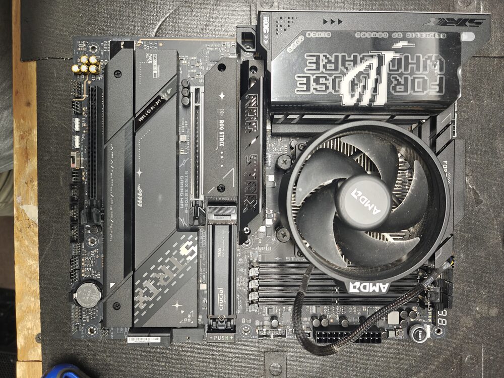 Close-up of a custom PC build motherboard and CPU cooler installation