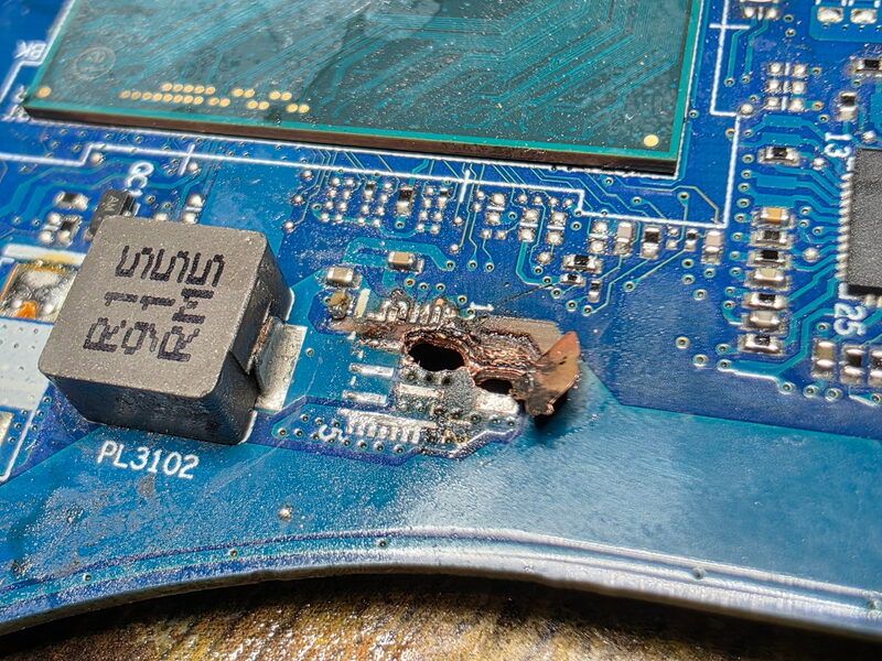 Close-up of circuit board damage being diagnosed